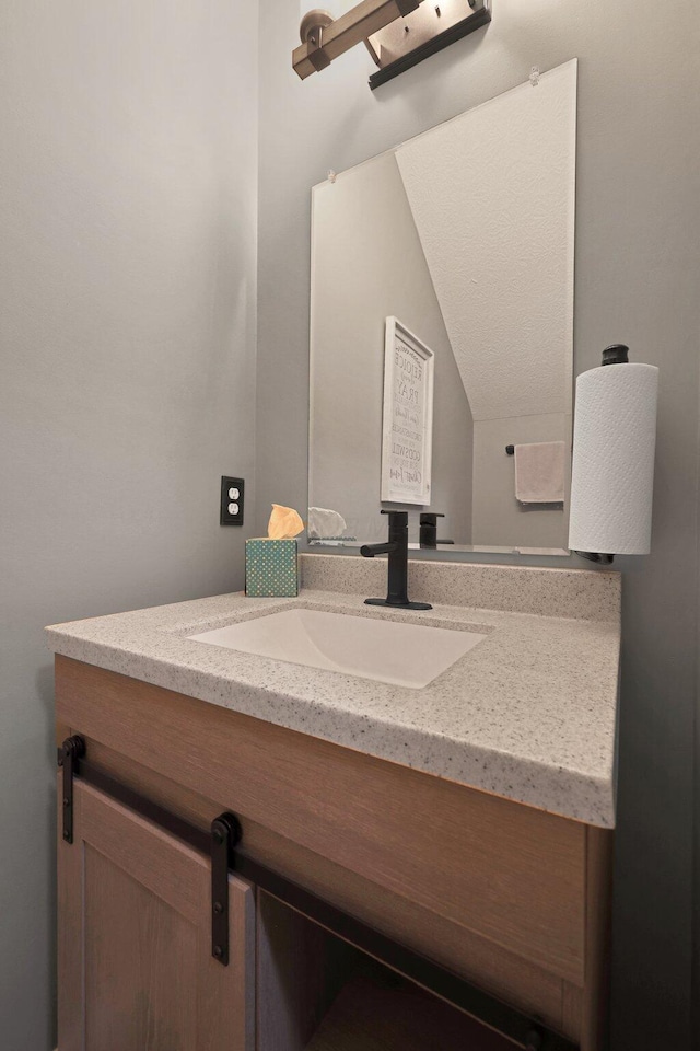 7911 Ashenden Dr, Blacklick, OH 43004 - bathroom with vanity and lofted ceiling