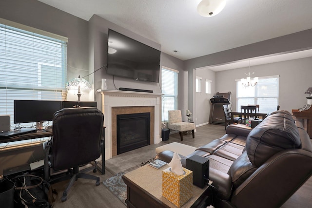 7911 Ashenden Dr, Blacklick, OH 43004 - living room with a chandelier, a fireplace, and an office area