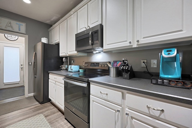 7911 Ashenden Dr, Blacklick, OH 43004 - kitchen with stainless steel appliances, white cabinets, light wood-type flooring, and recessed lighting