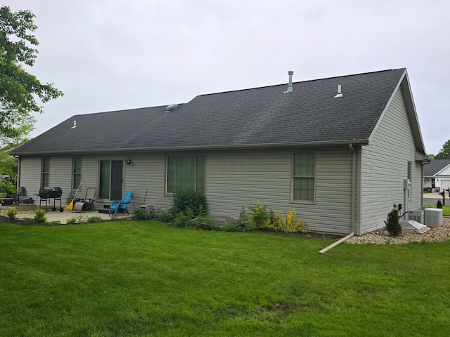 1919 Jared Pl, Lima, OH 45805 - back of property with a patio, a yard, and roof with shingles