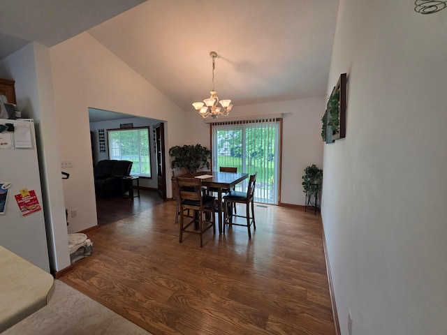 1919 Jared Pl, Lima, OH 45805 - dining space with a chandelier, vaulted ceiling, and wood finished floors