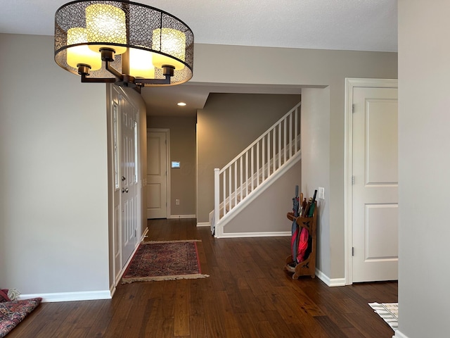 1013 Bluff Crest Dr, Columbus, OH 43235 - foyer featuring a chandelier, wood finished floors, and stairway