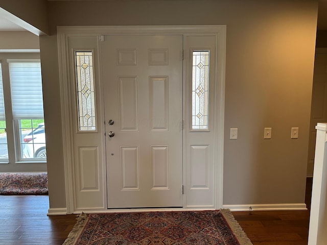1013 Bluff Crest Dr, Columbus, OH 43235 - entrance foyer featuring dark wood finished floors and baseboards