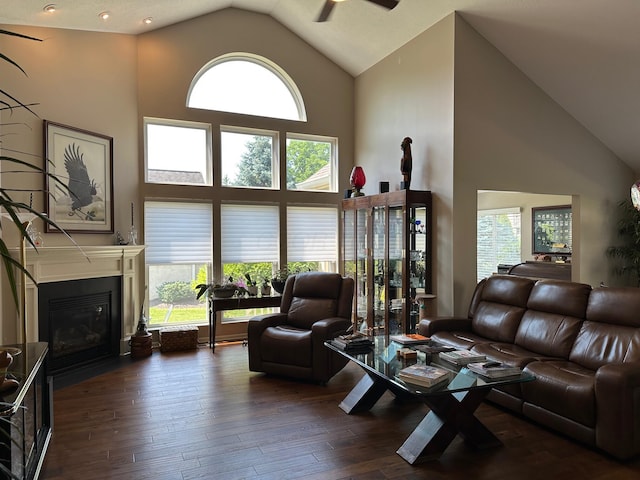 1013 Bluff Crest Dr, Columbus, OH 43235 - living area with high vaulted ceiling, a fireplace with flush hearth, a ceiling fan, and wood-type flooring
