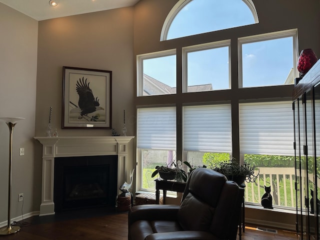 1013 Bluff Crest Dr, Columbus, OH 43235 - living room with wood finished floors, a fireplace with flush hearth, and healthy amount of natural light