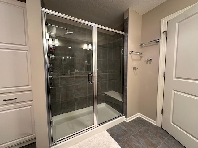 1013 Bluff Crest Dr, Columbus, OH 43235 - bathroom featuring a stall shower, tile patterned floors, and a textured ceiling