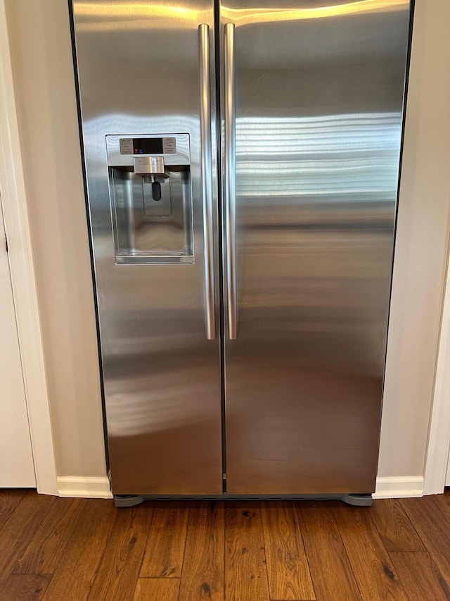 1013 Bluff Crest Dr, Columbus, OH 43235 - detailed view of stainless steel fridge with ice dispenser and dark wood-style floors