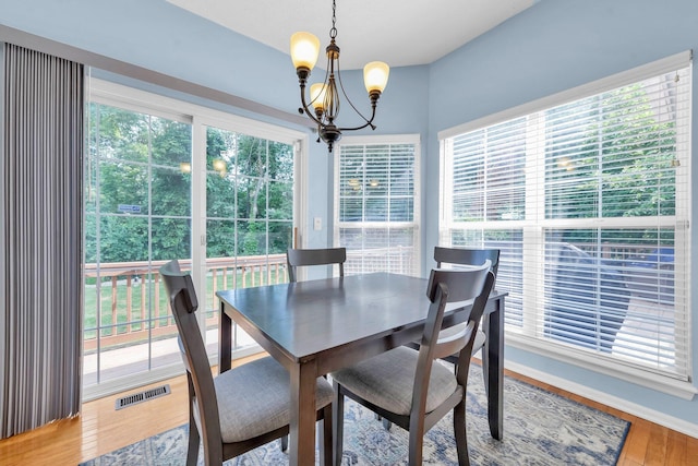 6598 Estate View Dr S, Blacklick, OH 43004 - dining area with a chandelier, healthy amount of natural light, and light wood-style flooring