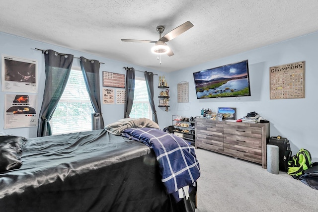 6598 Estate View Dr S, Blacklick, OH 43004 - bedroom featuring carpet flooring, a textured ceiling, and a ceiling fan