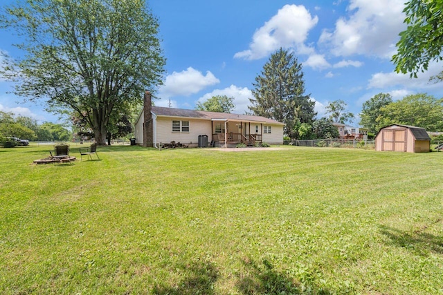7472 Davis Rd, Hilliard, OH 43026 - view of yard featuring a shed and an outdoor fire pit