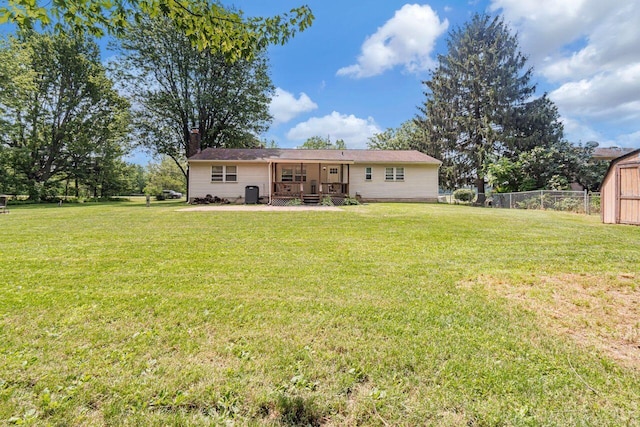 7472 Davis Rd, Hilliard, OH 43026 - rear view of house featuring a wooden deck, a chimney, and a storage unit