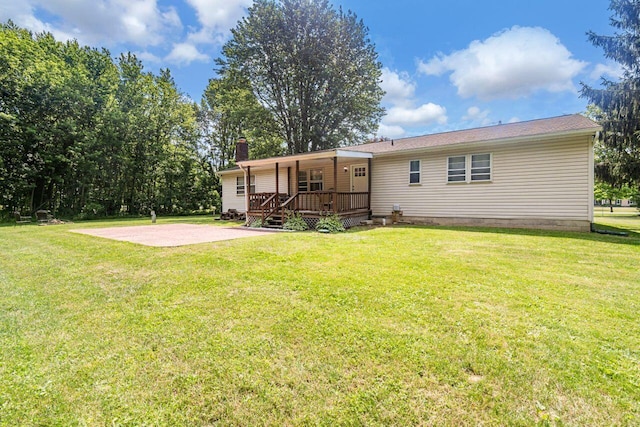 7472 Davis Rd, Hilliard, OH 43026 - back of house with a yard and a chimney