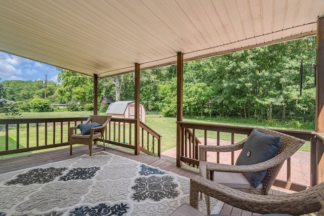 7472 Davis Rd, Hilliard, OH 43026 - deck featuring a storage shed, view of scattered trees, and a yard