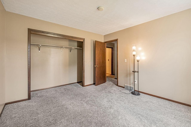 7472 Davis Rd, Hilliard, OH 43026 - unfurnished bedroom with carpet, a closet, and a textured ceiling