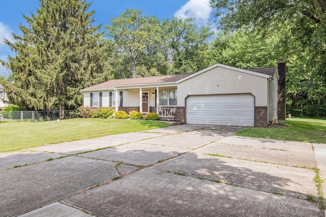 7472 Davis Rd, Hilliard, OH 43026 - ranch-style home featuring a porch, a garage, a chimney, driveway, and brick siding