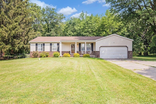 7472 Davis Rd, Hilliard, OH 43026 - ranch-style home with covered porch, a garage, and concrete driveway
