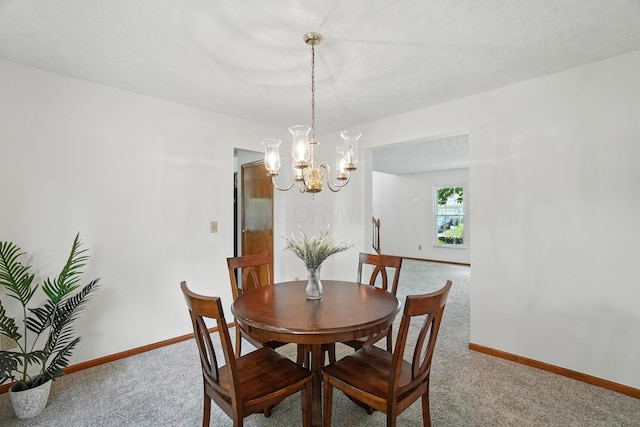 526 Springwood Lake Dr, Columbus, OH 43230 - dining room featuring carpet floors and a chandelier