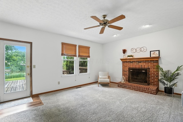 526 Springwood Lake Dr, Columbus, OH 43230 - unfurnished living room featuring a fireplace, a ceiling fan, carpet flooring, a textured ceiling, and recessed lighting