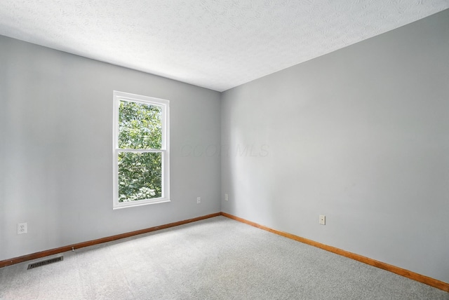 526 Springwood Lake Dr, Columbus, OH 43230 - empty room with carpet flooring and a textured ceiling
