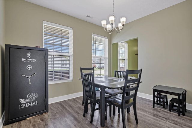 68 Asbury Ave, Newark, OH 43055 - dining space featuring a chandelier and dark wood-style floors