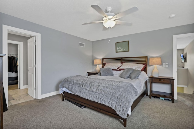 68 Asbury Ave, Newark, OH 43055 - carpeted bedroom featuring a walk in closet, ceiling fan, and a closet