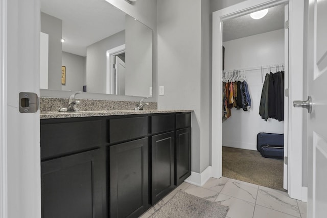 68 Asbury Ave, Newark, OH 43055 - full bath featuring double vanity, marble finish flooring, and a spacious closet
