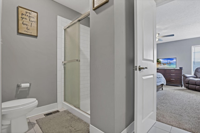 68 Asbury Ave, Newark, OH 43055 - ensuite bathroom with a stall shower, a ceiling fan, and tile patterned flooring