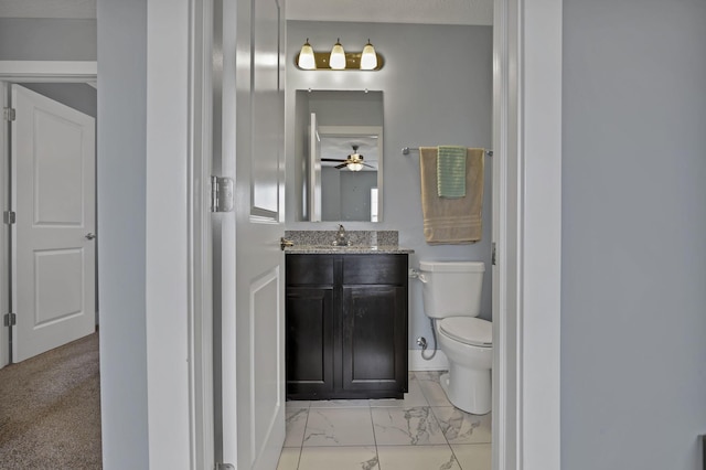 68 Asbury Ave, Newark, OH 43055 - bathroom with marble finish flooring, vanity, and a ceiling fan