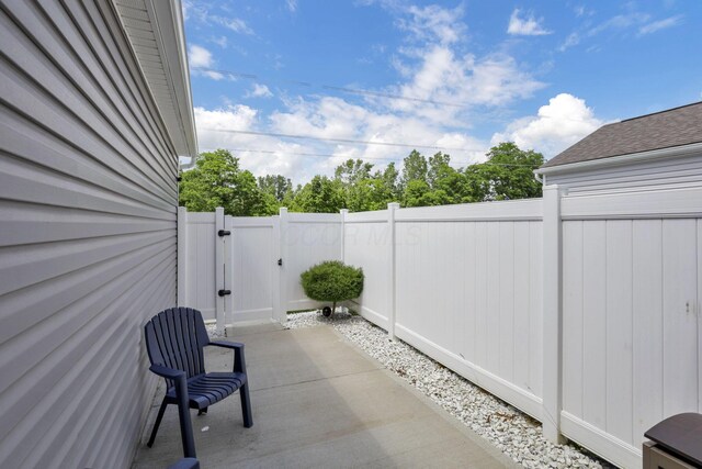 68 Asbury Ave, Newark, OH 43055 - fenced backyard featuring a gate and a patio area