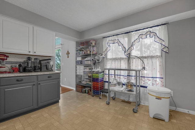 1691 Cloverdale Dr, Lancaster, OH 43130 - kitchen with gray cabinetry, light countertops, and white cabinets