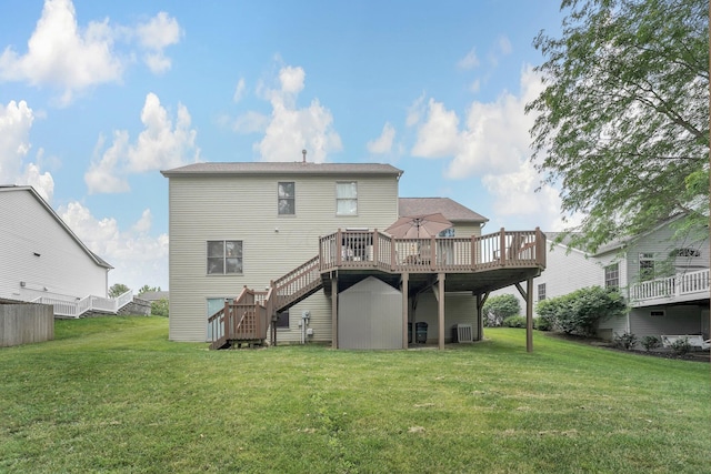 1691 Cloverdale Dr, Lancaster, OH 43130 - back of house featuring stairs, a deck, and a lawn