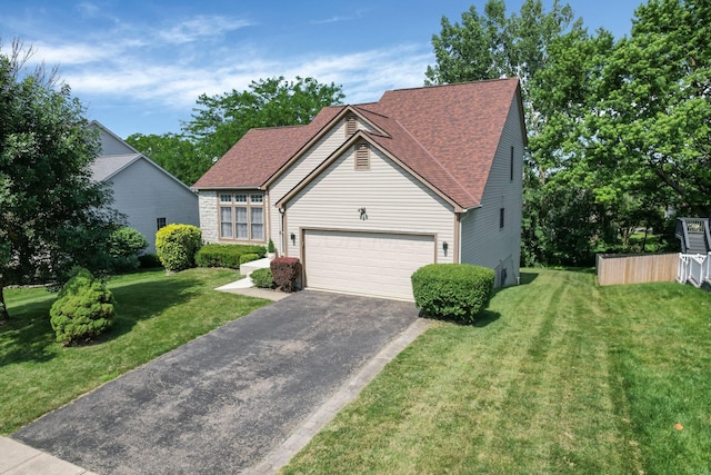 1691 Cloverdale Dr, Lancaster, OH 43130 - view of front of property featuring driveway, roof with shingles, a front lawn, and a garage