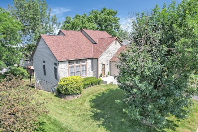 1691 Cloverdale Dr, Lancaster, OH 43130 - view of home's exterior with a lawn and roof with shingles