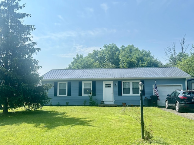 115 Woodsview Ct, Jeffersonville, OH 43128 - ranch-style home with an attached garage, a front lawn, and a metal roof