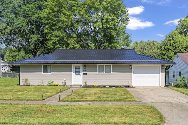 1815 Union St, Lancaster, OH 43130 - single story home with a metal roof, a garage, concrete driveway, and a standing seam roof