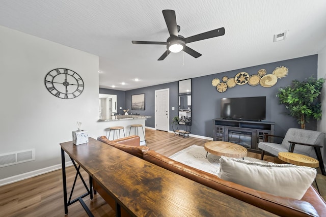 1815 Union St, Lancaster, OH 43130 - living area with ceiling fan, wood finished floors, a glass covered fireplace, and recessed lighting