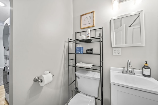 1815 Union St, Lancaster, OH 43130 - full bathroom featuring stacked washer and clothes dryer and vanity