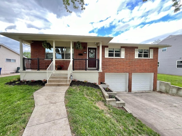 1492 Cottonwood Dr, Columbus, OH 43229 - view of front of house with concrete driveway, brick siding, a garage, and a front lawn