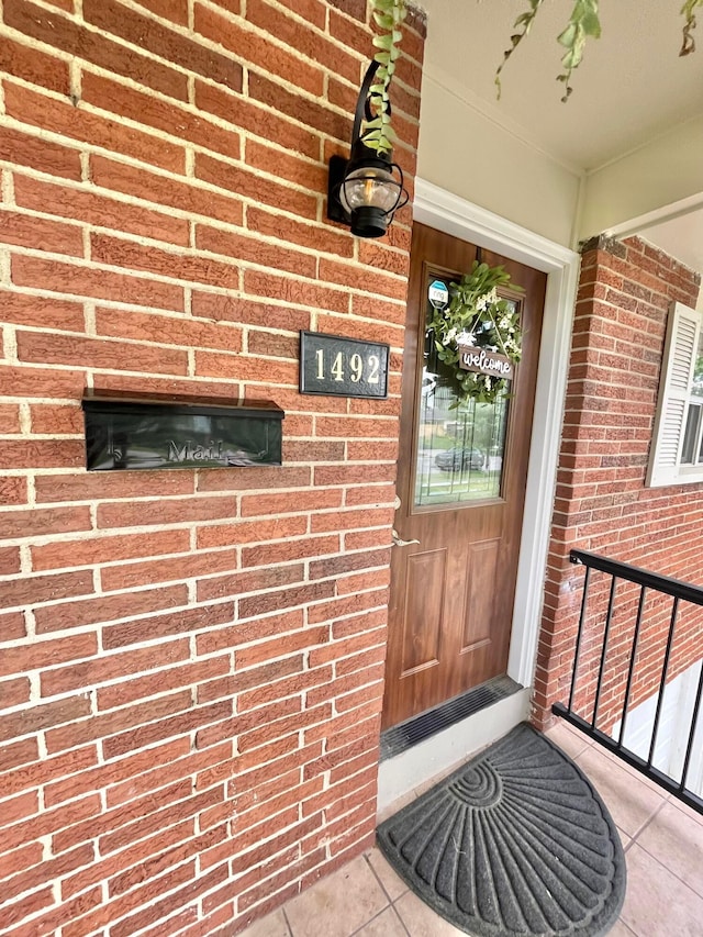 1492 Cottonwood Dr, Columbus, OH 43229 - property entrance featuring brick siding