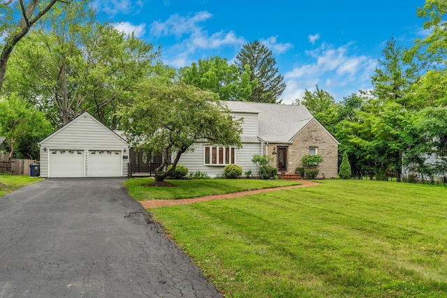 1054 Highland Dr, Columbus, OH 43220 - view of front facade with a front lawn, a shingled roof, stone siding, and driveway