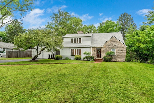 1054 Highland Dr, Columbus, OH 43220 - view of front of house with driveway, stone siding, a chimney, an attached garage, and a shingled roof