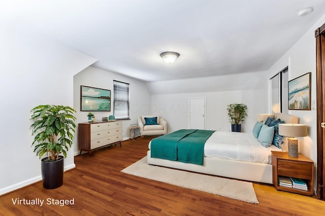 1054 Highland Dr, Columbus, OH 43220 - bedroom featuring wood finished floors and lofted ceiling