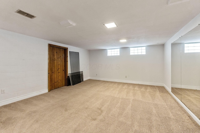 1054 Highland Dr, Columbus, OH 43220 - below grade area featuring light carpet and baseboards
