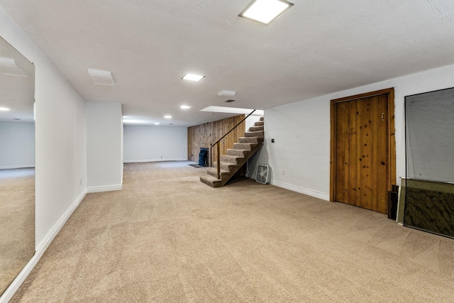 1054 Highland Dr, Columbus, OH 43220 - finished below grade area with light carpet and stairs