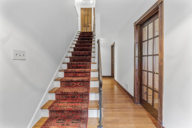 1054 Highland Dr, Columbus, OH 43220 - stairway featuring wood finished floors