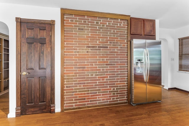 1054 Highland Dr, Columbus, OH 43220 - kitchen with stainless steel fridge with ice dispenser, wood finished floors, and arched walkways