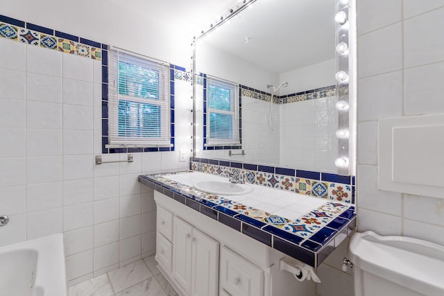1054 Highland Dr, Columbus, OH 43220 - bathroom with tile walls, vanity, marble finish floors, and  shower combination