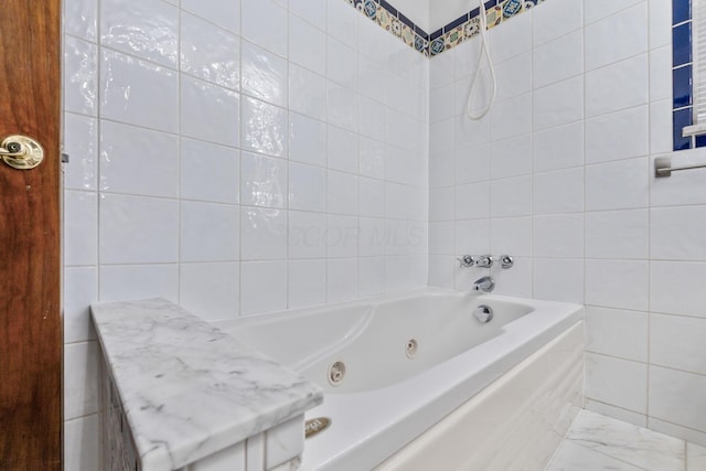 1054 Highland Dr, Columbus, OH 43220 - bathroom featuring tile walls and a jetted tub