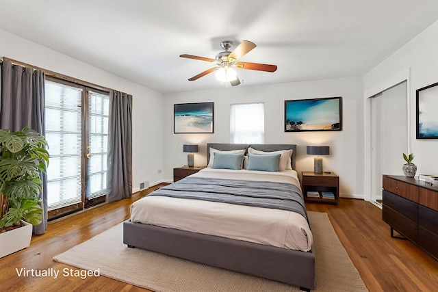 1054 Highland Dr, Columbus, OH 43220 - bedroom featuring multiple windows, wood finished floors, and a ceiling fan