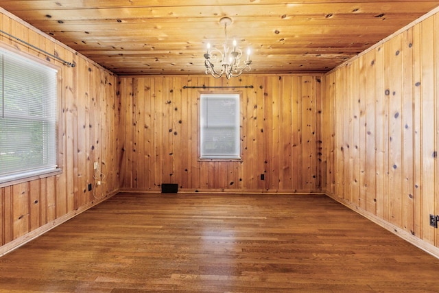 1054 Highland Dr, Columbus, OH 43220 - unfurnished room featuring a chandelier, wood finished floors, wooden ceiling, and wooden walls
